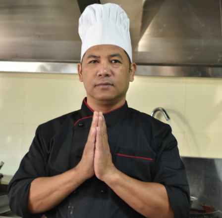 Chinese chef cooking at Pokhara Chinese Restaurant